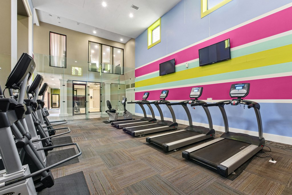 Fitness Center A gym with treadmills and exercise equipment.